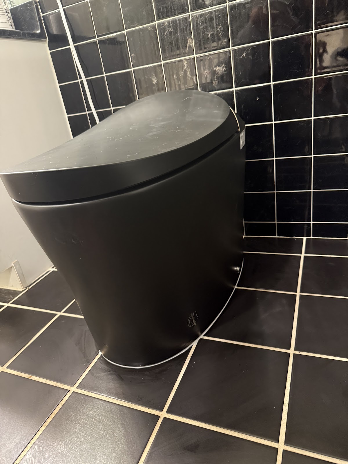 Matte black toilet install by WaveLine Plumbing